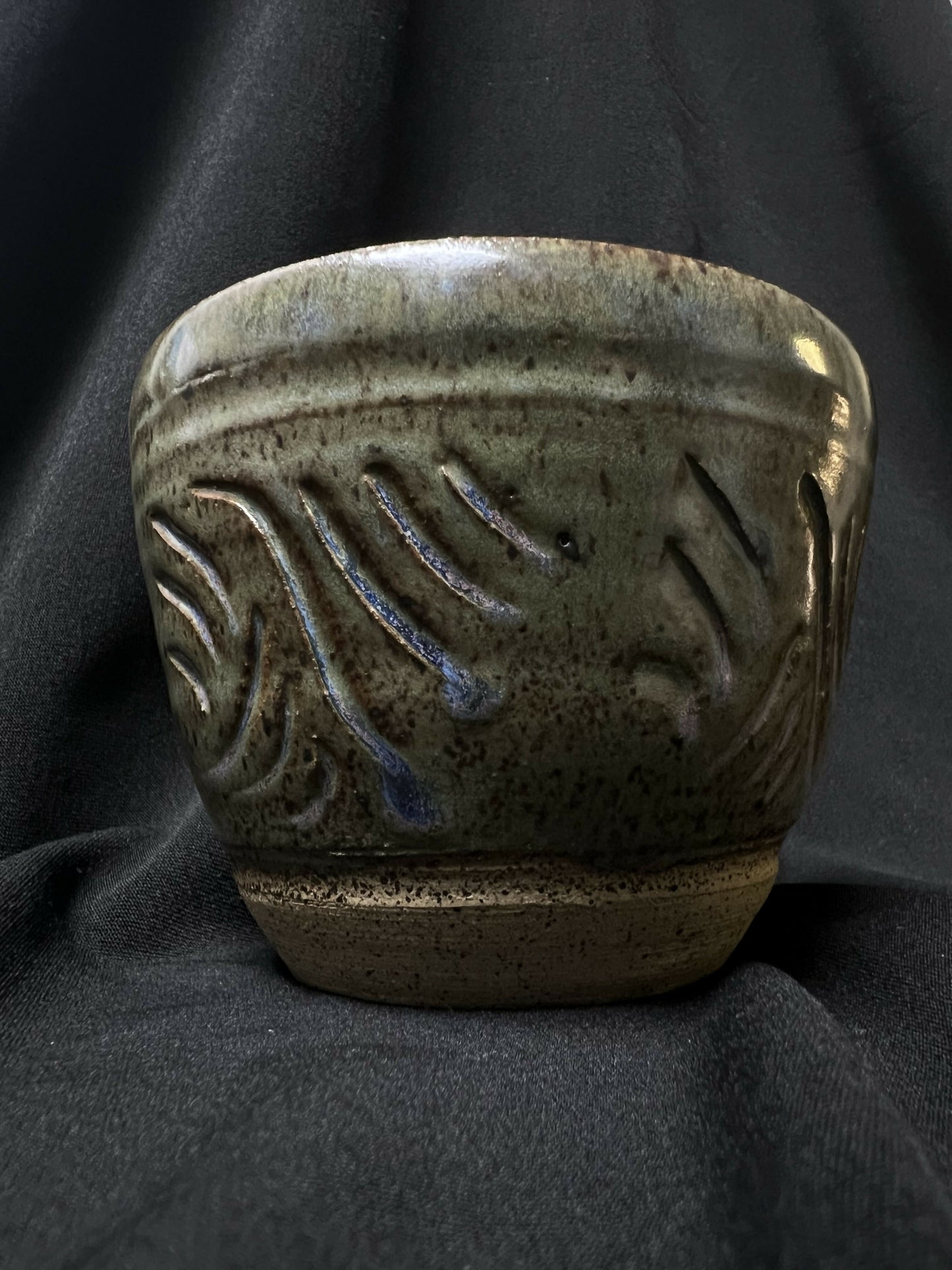 Pottery hand warm mug with blue green tones
