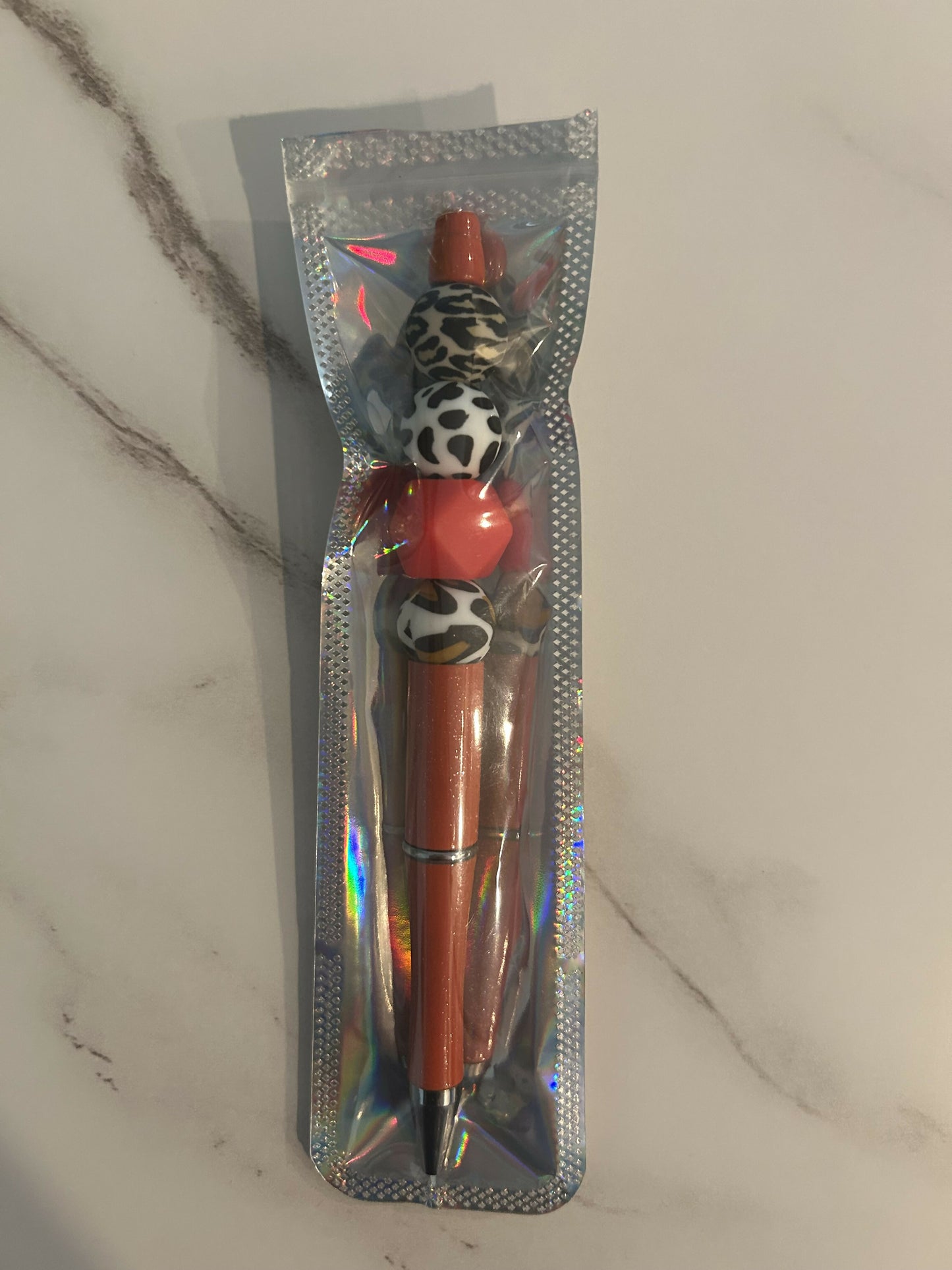 Red animal print pen