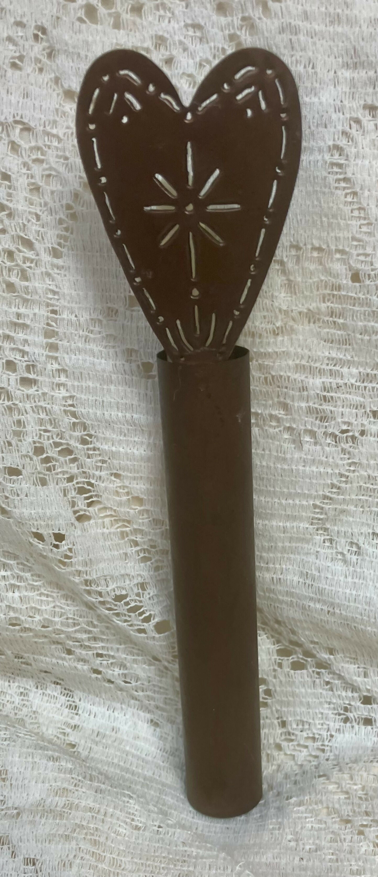 Prim taper candle cover with candle